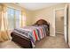Cozy bedroom with natural light, neutral walls, carpeted floors, and an attached closet at 2451 Broad River Pl, Ellenwood, GA 30294