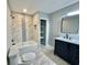 Renovated bathroom with a modern vanity, bathtub, and updated tile work, showcasing contemporary style at 5419 S Lake Dr, Douglasville, GA 30135