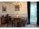 Dining room featuring modern chandelier, table set, and cabinet at 5419 S Lake Dr, Douglasville, GA 30135