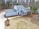 An overhead shot of the house showcases the gray siding and well-manicured yard at 5419 S Lake Dr, Douglasville, GA 30135