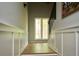 Hallway featuring wainscoting, wood-look floors, and a window providing natural light at 5419 S Lake Dr, Douglasville, GA 30135