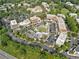 Aerial view of a commercial area with a mix of buildings, parking lots, and green spaces, showcasing its layout at 6815 Berkley Rd, Cumming, GA 30040