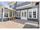 Inviting backyard patio with ample seating and natural light from the array of windows at 6815 Berkley Rd, Cumming, GA 30040