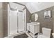 Bathroom featuring a glass enclosed shower with a white vanity and black and gold accent wall at 6815 Berkley Rd, Cumming, GA 30040