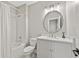 Bathroom featuring a shower/tub combo and a modern vanity with large round mirror at 6815 Berkley Rd, Cumming, GA 30040