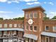 Historic clock tower features detailed brickwork and architectural charm in a walkable community at 6815 Berkley Rd, Cumming, GA 30040