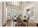 Formal dining room featuring hardwood floors, wainscoting, a chandelier, and view to staircase at 6815 Berkley Rd, Cumming, GA 30040