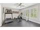 Exercise room with rubber floor, lots of light, and modern exercise equipment at 6815 Berkley Rd, Cumming, GA 30040
