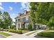 Charming two-story home with landscaped yard and elegant architectural details with a porte-cochère at 6815 Berkley Rd, Cumming, GA 30040