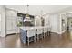 Gourmet kitchen with large marble island, stainless appliances, and open layout at 6815 Berkley Rd, Cumming, GA 30040