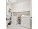 Functional laundry room with washer, dryer, and ample storage space at 6815 Berkley Rd, Cumming, GA 30040
