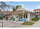 A charming storefront featuring a covered porch with outdoor seating and a welcoming entrance at 6815 Berkley Rd, Cumming, GA 30040