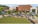 Inviting town square with outdoor seating surrounded by attractive brick buildings at 6815 Berkley Rd, Cumming, GA 30040