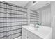 Clean bathroom featuring a shower/tub, single vanity, and muted tones at 2207 Concordia Se Way # 12, Mableton, GA 30126