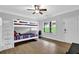 Bright bedroom features a bunk bed and modern ceiling fan, perfect for children or guests at 2207 Concordia Se Way # 12, Mableton, GA 30126