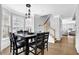 Dining room with large bay windows, wood floors, and seating for eight at 2207 Concordia Se Way # 12, Mableton, GA 30126