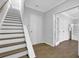 Spacious foyer with wood floors, staircase, and access to multiple rooms at 2207 Concordia Se Way # 12, Mableton, GA 30126