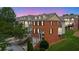 Exterior evening shot of brick townhomes with bay windows and attached garages at 2207 Concordia Se Way # 12, Mableton, GA 30126