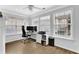 Well-lit home office with large windows and built-in shelving at 2207 Concordia Se Way # 12, Mableton, GA 30126