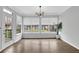 Bright sunroom with large windows, hardwood flooring, and a view of the backyard at 2207 Concordia Se Way # 12, Mableton, GA 30126