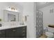 Modern bathroom featuring a sleek vanity with brass fixtures and a shower with decorative curtain at 2808 Vinings Central Se Dr # 158, Atlanta, GA 30339