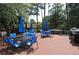 Spacious deck area with multiple tables, chairs and umbrellas for resident's outdoor dining at 2808 Vinings Central Se Dr # 158, Atlanta, GA 30339
