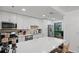 Bright kitchen with white cabinets, quartz countertops, stainless appliances and breakfast bar at 2808 Vinings Central Se Dr # 158, Atlanta, GA 30339