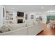 Spacious living room boasts a large sectional sofa, fireplace, TV, and built-in shelving at 2808 Vinings Central Se Dr # 158, Atlanta, GA 30339