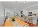 Open living and dining area featuring hardwood floors, fireplace, and kitchen with white cabinets at 2808 Vinings Central Se Dr # 158, Atlanta, GA 30339