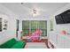 Bright playroom with multiple windows, white built-ins, a television, and a play area at 2808 Vinings Central Se Dr # 158, Atlanta, GA 30339