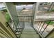 Staircase with a view of the property's exterior through a railing at 2808 Vinings Central Se Dr # 158, Atlanta, GA 30339