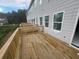 View of the deck along the back of the home featuring wood flooring and railings at 4263 Notting Hill Sw Dr, Atlanta, GA 30331