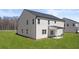 Picture of the backyard showing the home's siding and covered patio at 1949 Van Allen Ct, Dacula, GA 30019