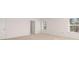 Large main bedroom with neutral carpet, white walls, and natural light at 1949 Van Allen Ct, Dacula, GA 30019