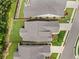 Overhead view of residential properties, displaying rooflines, landscaping, and the layout of neighborhood streets at 215 Windsor Park Dr, Woodstock, GA 30188
