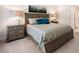 Comfortable bedroom with queen bed, lamps, and carpet at 215 Windsor Park Dr, Woodstock, GA 30188