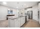 Bright kitchen with stainless appliances, large center island with bar seating at 215 Windsor Park Dr, Woodstock, GA 30188