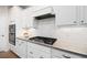 Well-equipped kitchen featuring granite countertops, stainless steel appliances, and ample cabinet space at 215 Windsor Park Dr, Woodstock, GA 30188