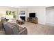Comfortable living room features a fireplace, tv, and wood-look floors at 215 Windsor Park Dr, Woodstock, GA 30188