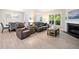 Cozy living room with a fireplace, comfortable seating, and natural light at 215 Windsor Park Dr, Woodstock, GA 30188