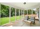 Relaxing sunroom featuring floor to ceiling windows and outdoor views at 215 Windsor Park Dr, Woodstock, GA 30188