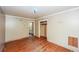 Bedroom featuring hardwood floors, a closet, and a sun-filled window at 3179 Dogwood Dr, Atlanta, GA 30344