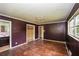 Spacious bedroom with hardwood floors, large windows, closet, and bathroom access at 3179 Dogwood Dr, Atlanta, GA 30344