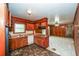 View of kitchen and living room, featuring wooden cabinets and a tile floor at 3179 Dogwood Dr, Atlanta, GA 30344