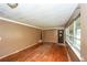 Open-concept living room featuring hardwood floors, large windows, and a neutral color palette at 3179 Dogwood Dr, Atlanta, GA 30344