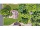 Aerial view of a home with a large yard surrounded by mature trees at 3358 North Ct, Ellenwood, GA 30294