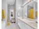Bathroom features double sinks, neutral walls, and a large mirror at 3358 North Ct, Ellenwood, GA 30294