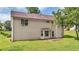 A shot of the house showing the backyard, patio, and beige siding at 3358 North Ct, Ellenwood, GA 30294
