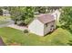 Image of the backyard featuring a well-maintained lawn and the light beige siding of the house at 3358 North Ct, Ellenwood, GA 30294