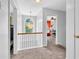 Upstairs hallway area with natural lighting and views into rooms at 3358 North Ct, Ellenwood, GA 30294